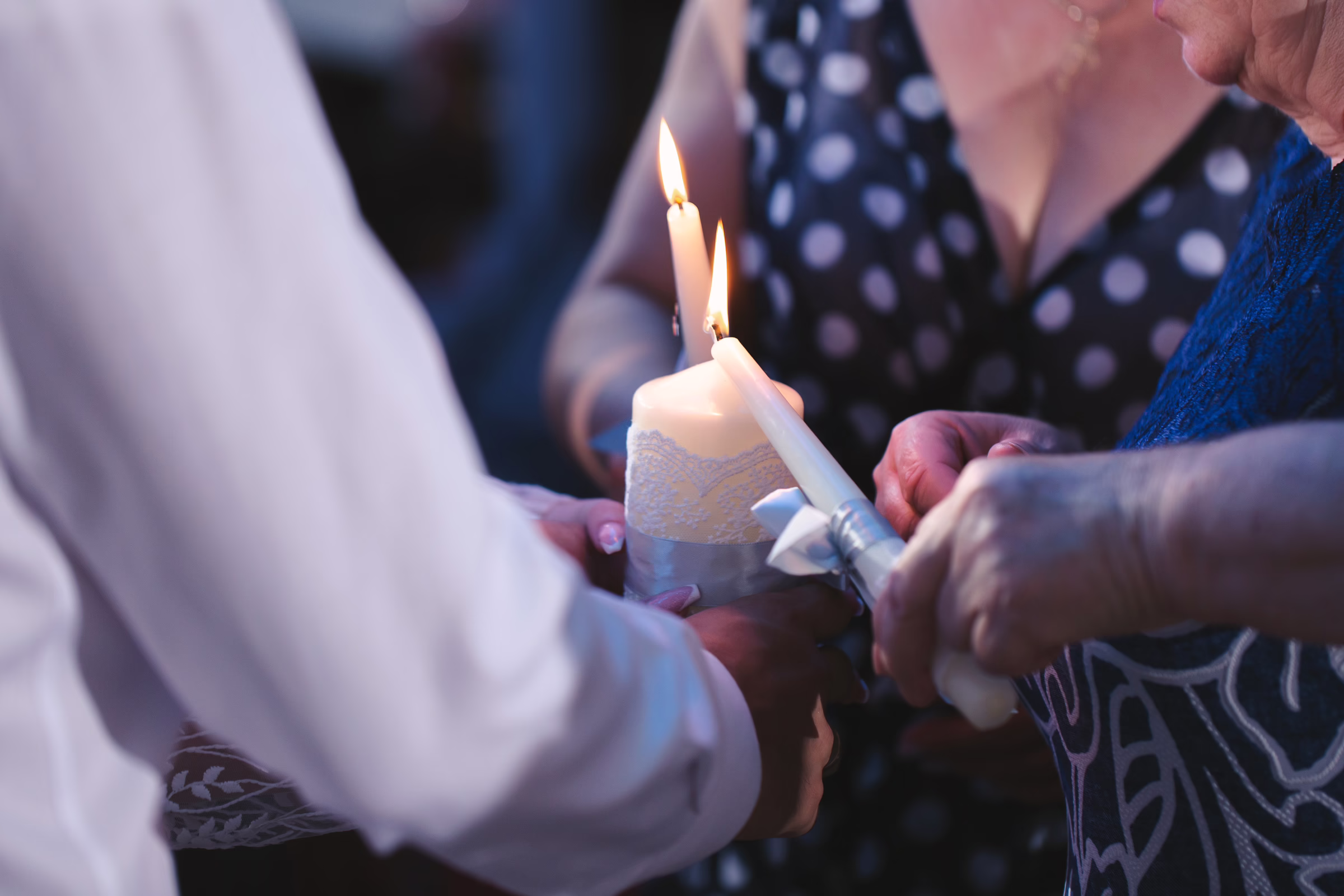 celebration of life candle lighting ceremony orlando celebration gardens winter park - Social Events Intimate candle lighting ceremony during celebration of life service at Orlando Celebration Gardens in Winter Park, Florida, showing hands holding memorial candles in remembrance