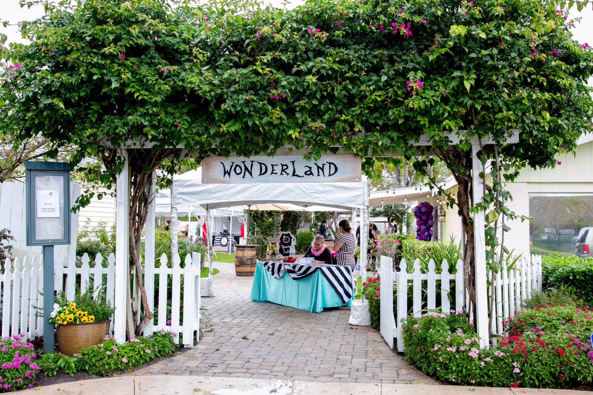 social event wonderland themed party celebration gardens winter park orlando - Social Events Wonderland themed social event setup with turquoise and black striped linens under garden pergola at Celebration Gardens wedding venue in Winter Park Orlando Florida