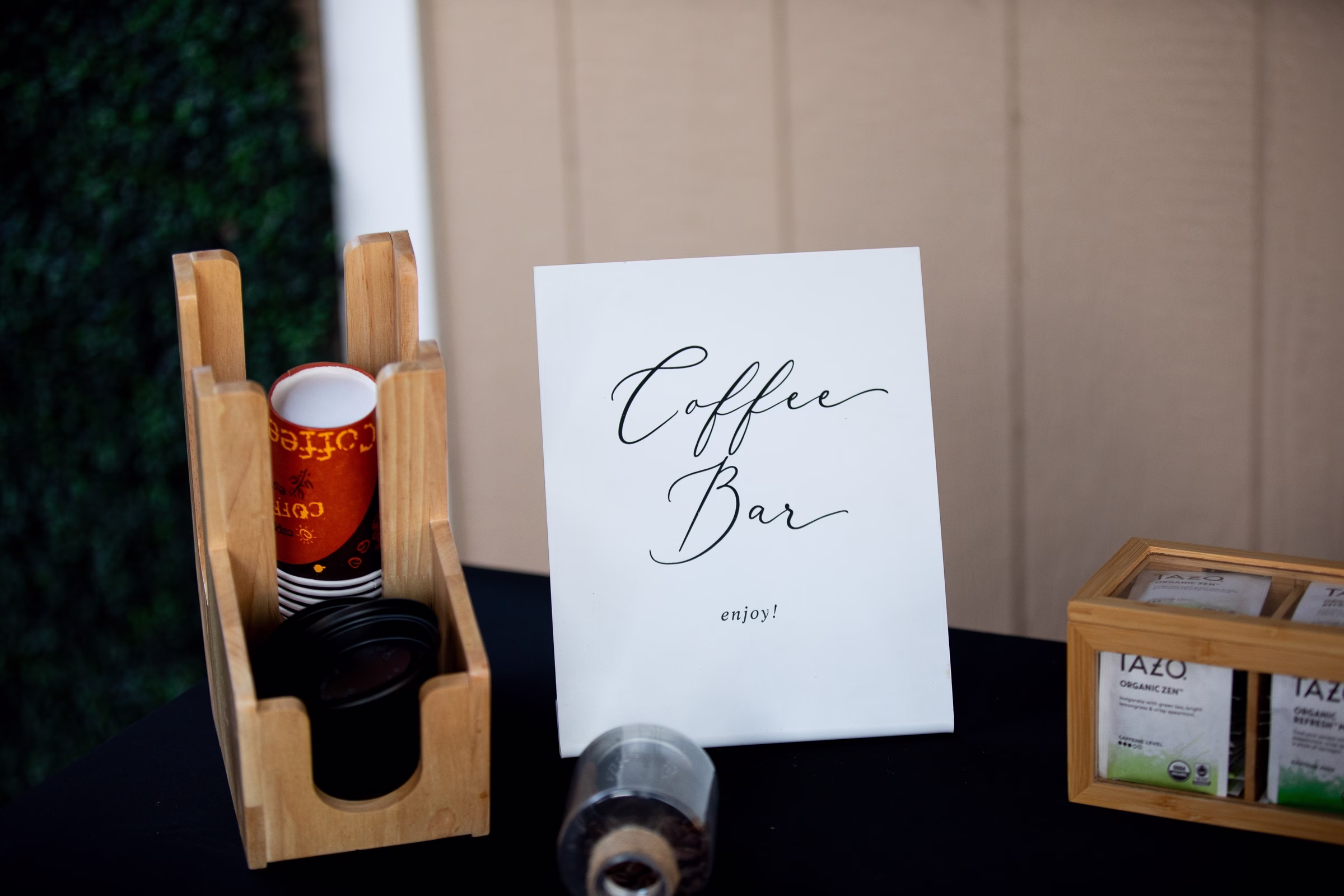 Elegant coffee bar station with calligraphy sign, disposable cups, and Tazo tea selection at Orlando Celebration Gardens wedding venue in Orlando Florida